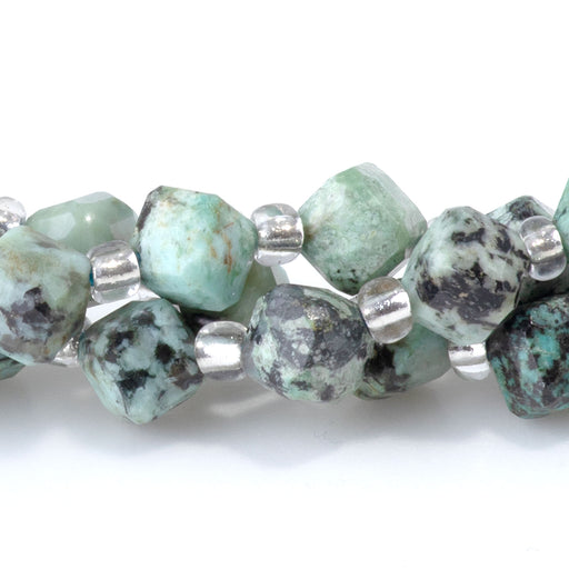 This is a Dakota Stones 4x6mm African Turquoise Corner Gemstone strand with table-cut cube beads in 15-16 inch strand.