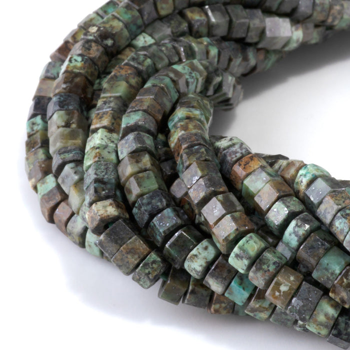 This is a Dakota Stones 6mm African Turquoise Large Hole Gemstone strand with faceted hexagon beads in 8 inch strand.