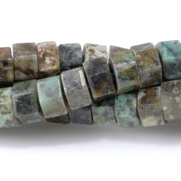 This is a Dakota Stones 6mm African Turquoise Large Hole Gemstone strand with faceted hexagon beads in 8 inch strand.