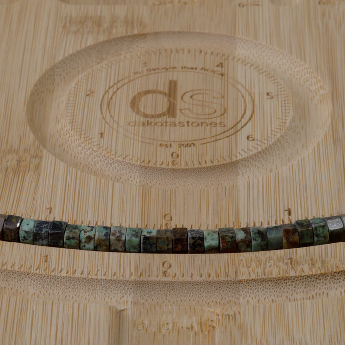 This is a Dakota Stones 6mm African Turquoise Large Hole Gemstone strand with faceted hexagon beads in 8 inch strand.