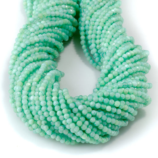 This is a Dakota Stones 2-3mm Special Price Green Opal Gemstone strand with faceted round beads in 15 inch strand.