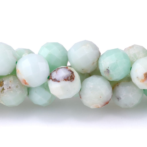 This is a Dakota Stones 8mm Apple Green Chrysoprase Gemstone strand with faceted round beads in 15-16 inch strand.