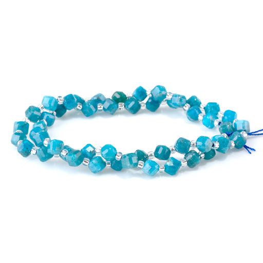 This is a Dakota Stones 4x6mm Blue Apatite Corner Gemstone strand with table-cut cube beads in 15-16 inch strand.