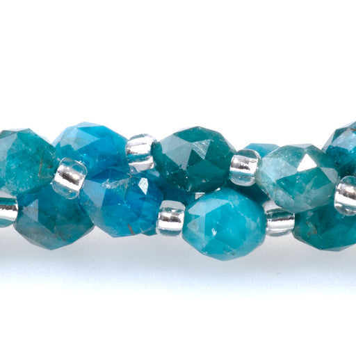 This is a Dakota Stones 4x6mm Blue Apatite Triangle Cut Rice Gemstone strand with A grade faceted beads in 15-16 inch strand.