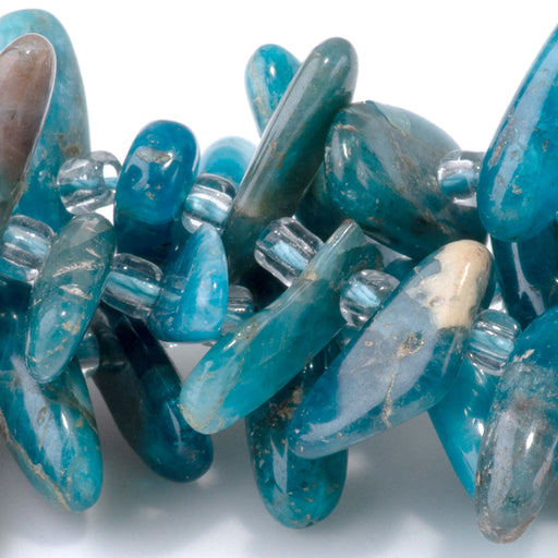 This is a Dakota Stones 5x10-20mm Blue Apatite Top Drill Teeth Gemstone strand of round beads in 15-16 inch strand.