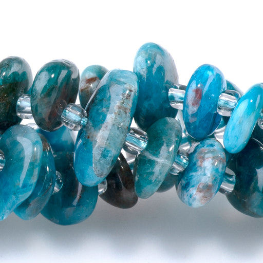 This is a Dakota Stones Blue Apatite 5x8m Gemstone strand with chip beads in 15-16 inch strand.