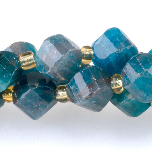 This is a Dakota Stones 7x8mm Blue Apatite Swirl Gemstone strand with faceted oval beads in 15-16 inch strand.
