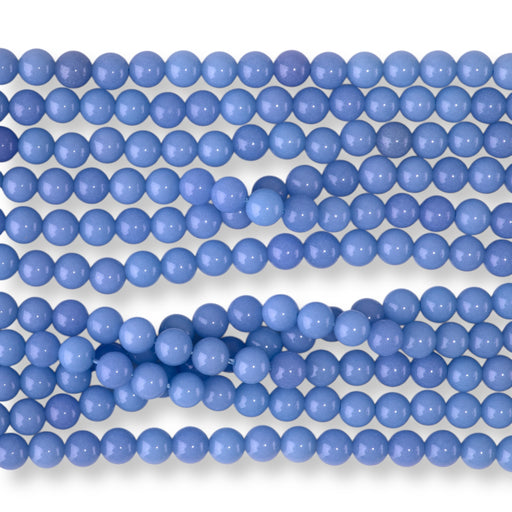 This is a Dakota Stones 6mm Blue Aragonite Gemstone strand with round beads in 15-16 inch strand.