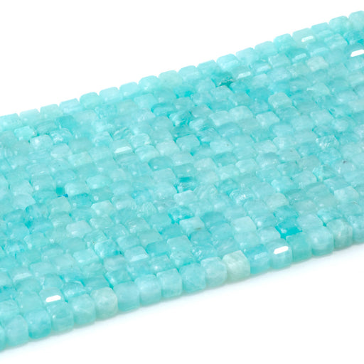 This is a Dakota Stones 4mm Brazilian Amazonite Gemstone strand with natural A grade table-cut cube beads in 15-16 inch strand.