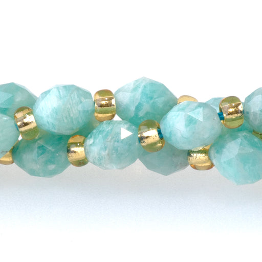 This is a Dakota Stones 4x6mm Brazilian Amazonite Triangle Cut Rice Gemstone strand with A grade faceted beads in 15-16 inch strand.