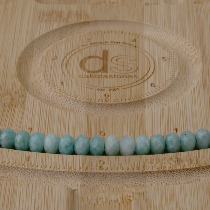 This is a Dakota Stones 5x8mm Brazilian Amazonite Large Hole Gemstone strand with faceted rondelle beads in 8 inch strand.