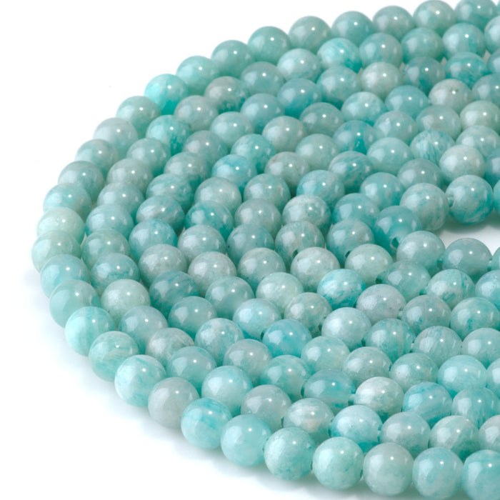 This is a Dakota Stones 6mm Brazilian Amazonite Large Hole Gemstone strand with round beads in 8 inch strand.
