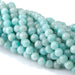 This is a Dakota Stones 6mm Brazilian Amazonite Large Hole Gemstone strand with round beads in 8 inch strand.