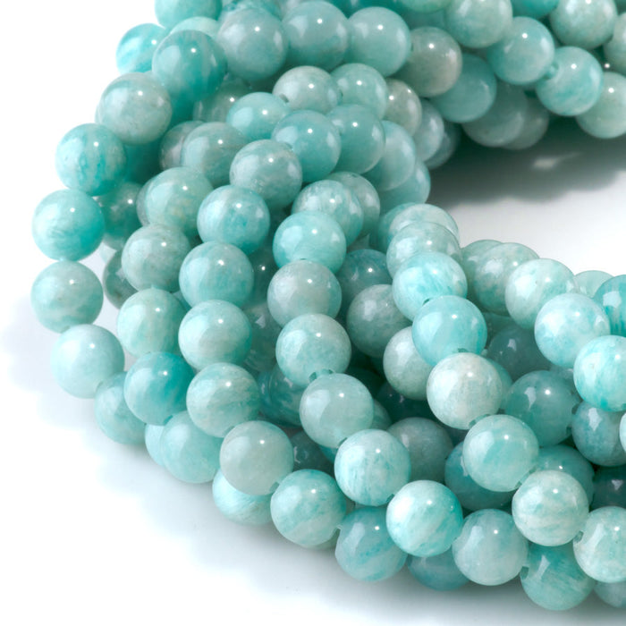 This is a Dakota Stones 6mm Brazilian Amazonite Large Hole Gemstone strand with round beads in 8 inch strand.