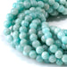 This is a Dakota Stones 6mm Brazilian Amazonite Large Hole Gemstone strand with round beads in 8 inch strand.