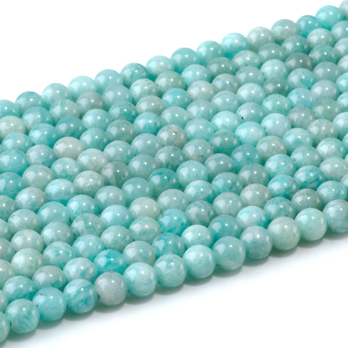 This is a Dakota Stones 6mm Brazilian Amazonite Large Hole Gemstone strand with round beads in 8 inch strand.