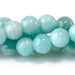 This is a Dakota Stones 6mm Brazilian Amazonite Large Hole Gemstone strand with round beads in 8 inch strand.