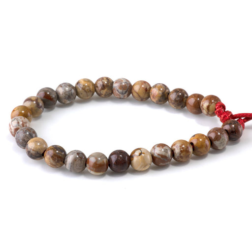 This is a Dakota Stones 8mm Birds Eye Rhyolite Large Hole Gemstone strand with round beads in 8 inch strand.