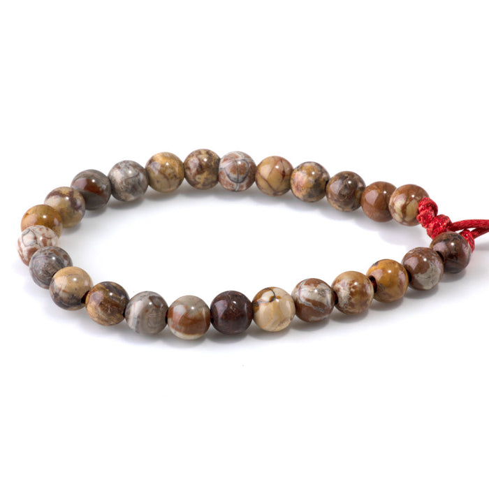This is a Dakota Stones 8mm Birds Eye Rhyolite Large Hole Gemstone strand with round beads in 8 inch strand.