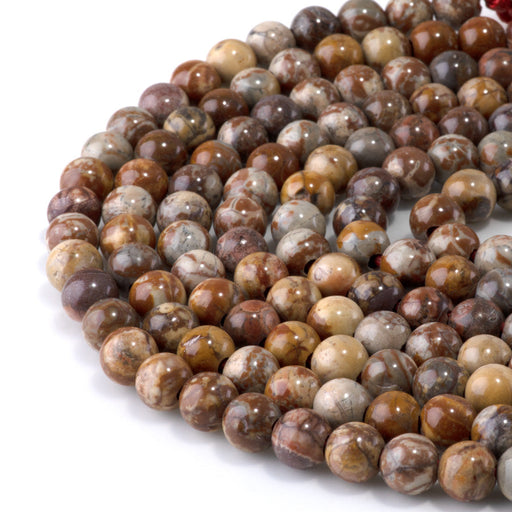 This is a Dakota Stones 8mm Birds Eye Rhyolite Large Hole Gemstone strand with round beads in 8 inch strand.