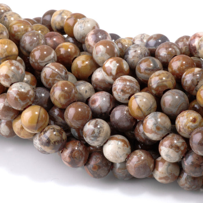 This is a Dakota Stones 8mm Birds Eye Rhyolite Large Hole Gemstone strand with round beads in 8 inch strand.