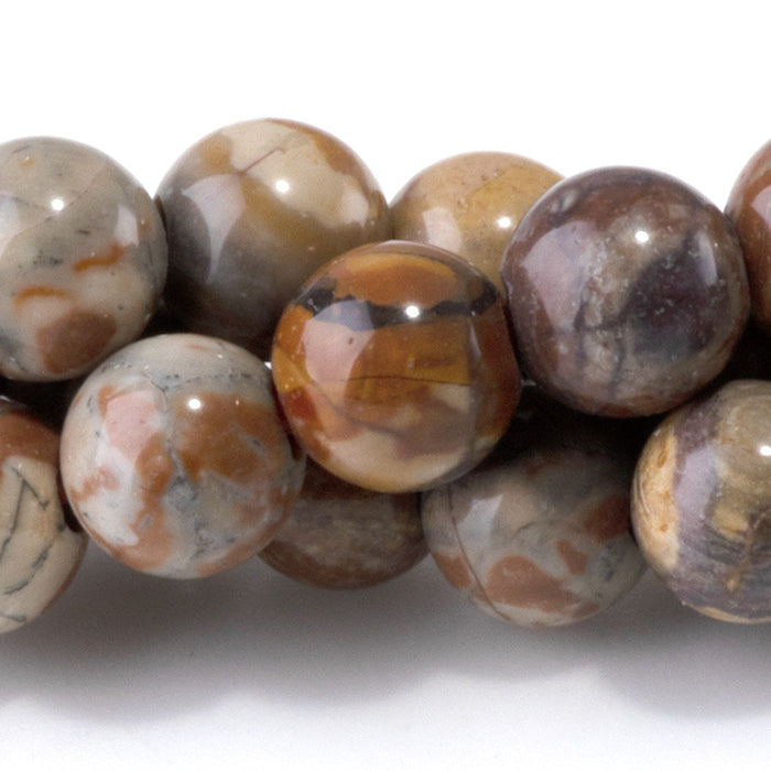 This is a Dakota Stones 8mm Birds Eye Rhyolite Large Hole Gemstone strand with round beads in 8 inch strand.