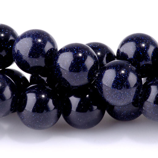 This is a Dakota Stones 10mm Blue Goldstone Gemstone strand with round beads in 15-16 inch strand.