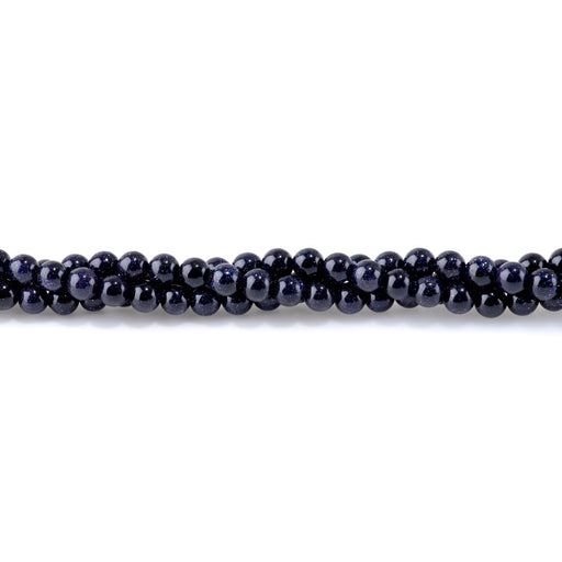 This is a Dakota Stones 6mm Blue Goldstone Gemstone strand with round beads in 15-16 inch strand.