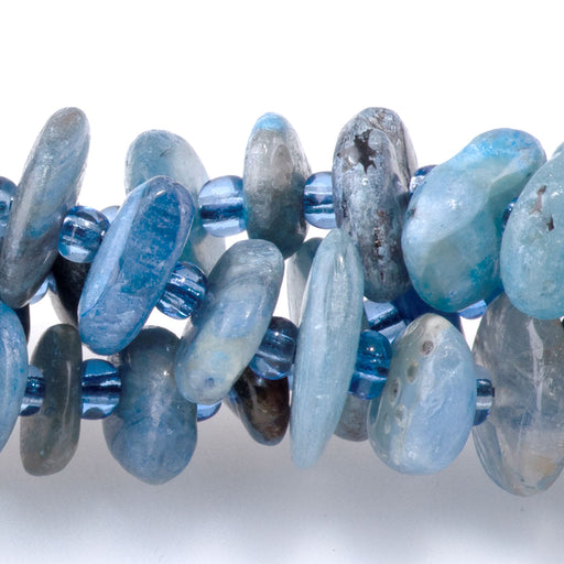 This is a Dakota Stones Blue Kyanite 5x8m Gemstone strand with chip beads in 15-16 inch strand.