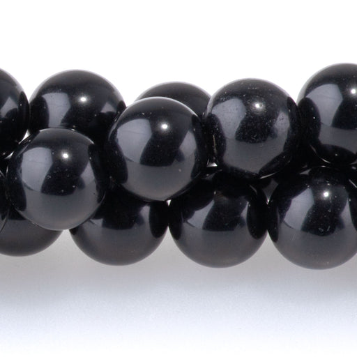 This is a Dakota Stones 8mm Black Obsidian Gemstone strand with round beads in 15-16 inch strand.