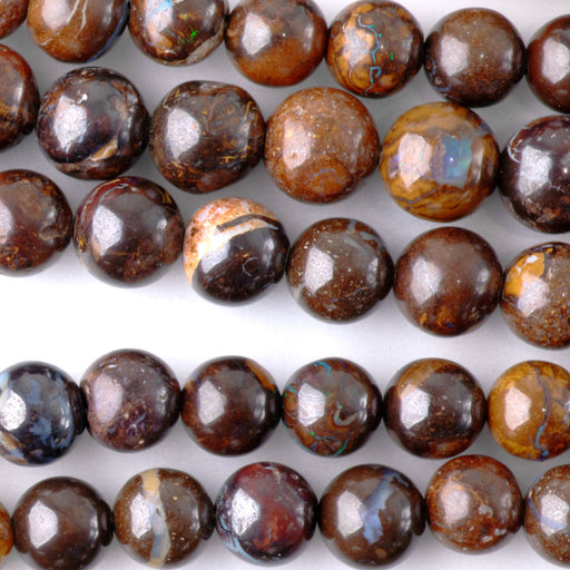 This is a Dakota Stones 5-6mm Australian Boulder Opal Necklace Gemstone strand with round beads in 15-16 inch strand.