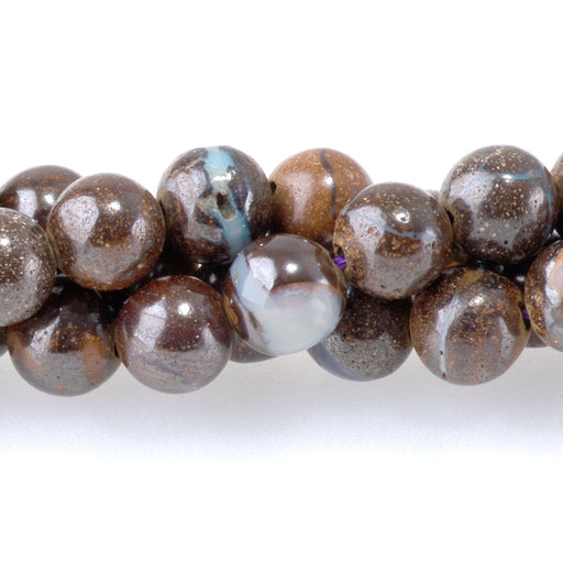 This is a Dakota Stones 6mm Australian Boulder Opal Gemstone strand with round beads in 15-16 inch strand.