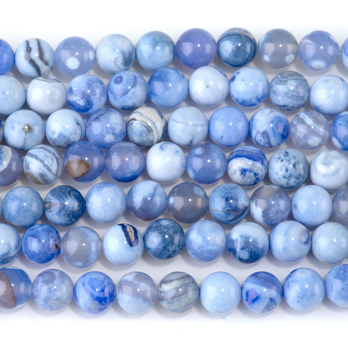 This is a Dakota Stones Blue Porcelain Agate8mm Gemstone strand with round beads in 15-16 inch strand.
