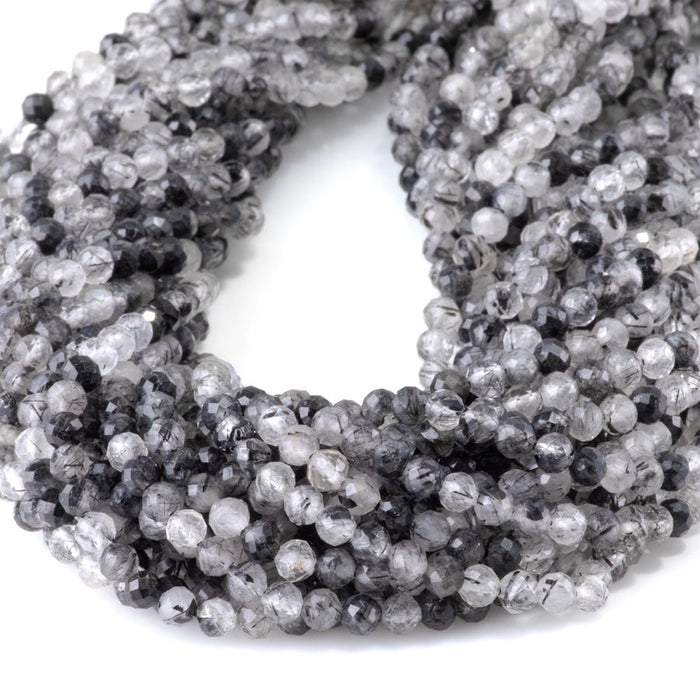 This is a Dakota Stones 4mm Black Rutilated Quartz Micofaceted Gemstone strand with round beads in 15-16 inch strand.