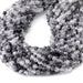 This is a Dakota Stones 4mm Black Rutilated Quartz Micofaceted Gemstone strand with round beads in 15-16 inch strand.