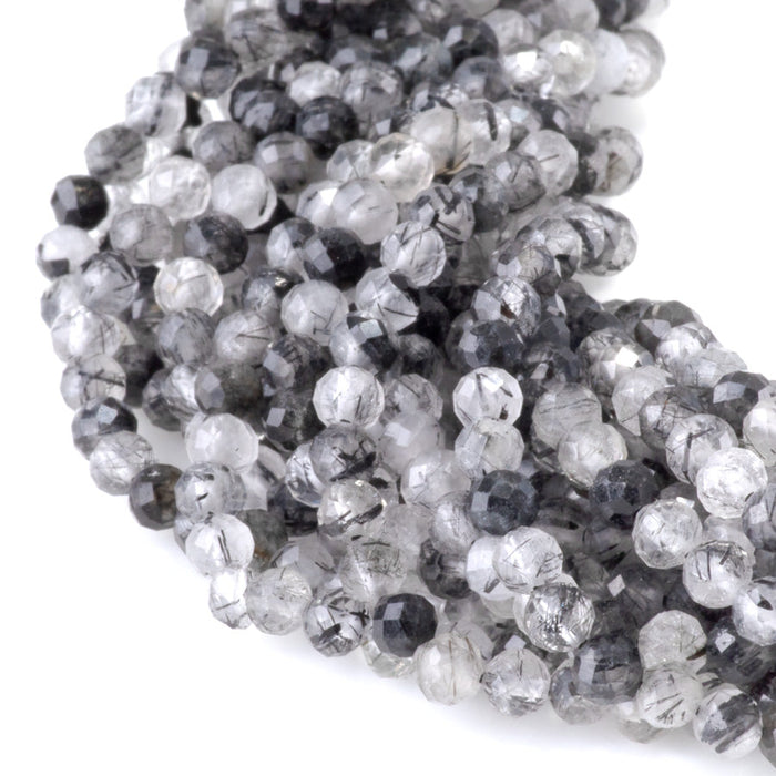 This is a Dakota Stones 4mm Black Rutilated Quartz Micofaceted Gemstone strand with round beads in 15-16 inch strand.