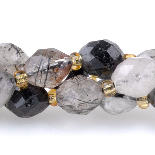 This is a Dakota Stones 7x8mm Black Rutilated Quartz Egg Gemstone strand with faceted beads in 15-16 inch strand.