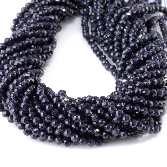 This is a Dakota Stones 4mm Blue Goldstone Microfaceted Gemstone strand with round beads in 15-16 inch strand.