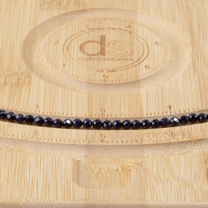 This is a Dakota Stones 4mm Blue Goldstone Microfaceted Gemstone strand with round beads in 15-16 inch strand.
