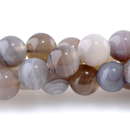 This is a Dakota Stones 6mm Botswana Agate Gemstone strand with round beads in 8 inch strand.