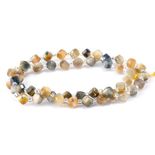This is a Dakota Stones 4x6mm Blue Tiger Eye Corner Gemstone strand with table-cut cube beads in 15-16 inch strand.