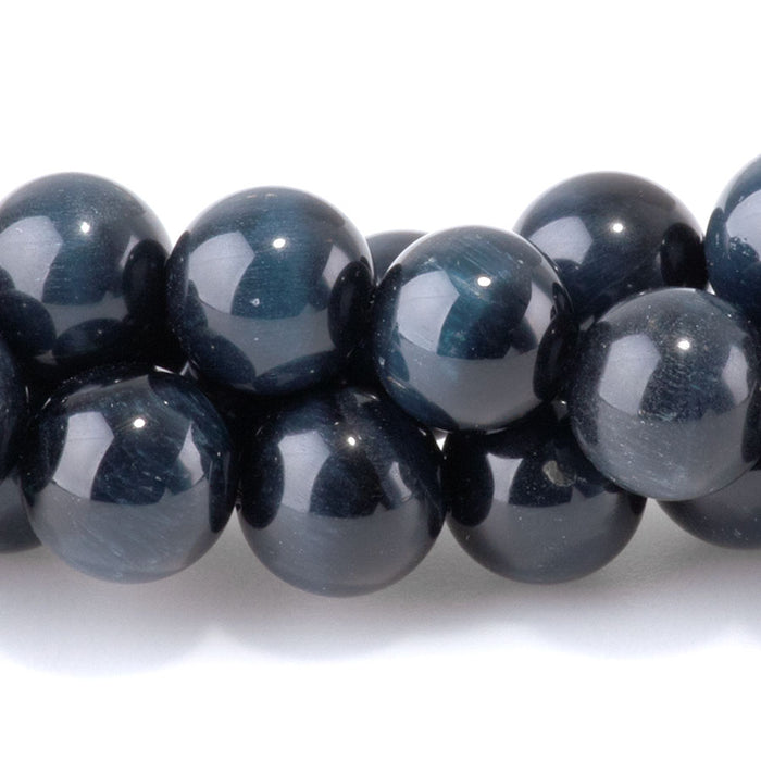 This is a Dakota Stones 8mm Blue Tiger Eye Gemstone strand with AAA grade round beads in 15-16 inch strand.