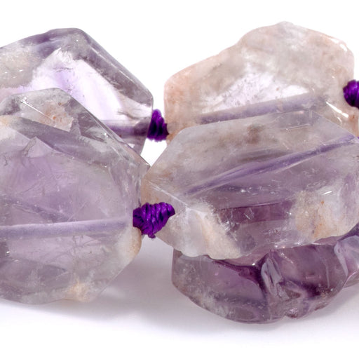 This is a Dakota Stones 12-18mm Cacoxenite Flat Hexagon Gemstone strand with free-form beads in 15-16 inch strand.