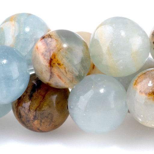 This is a Dakota Stones 10mm Lemurian Aquatine Calcite Gemstone strand with round beads in 8 inch strand.