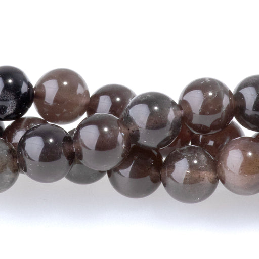 This is a Dakota Stones 6mm Cats Eye Gemstone strand with A grade round beads in 15-16 inch strand.