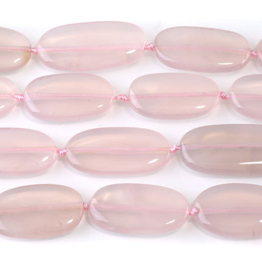 This is a Dakota Stones 13x22-30mm Pink Chalcedony Gemstone strand with oval beads in 15-16 inch strand.