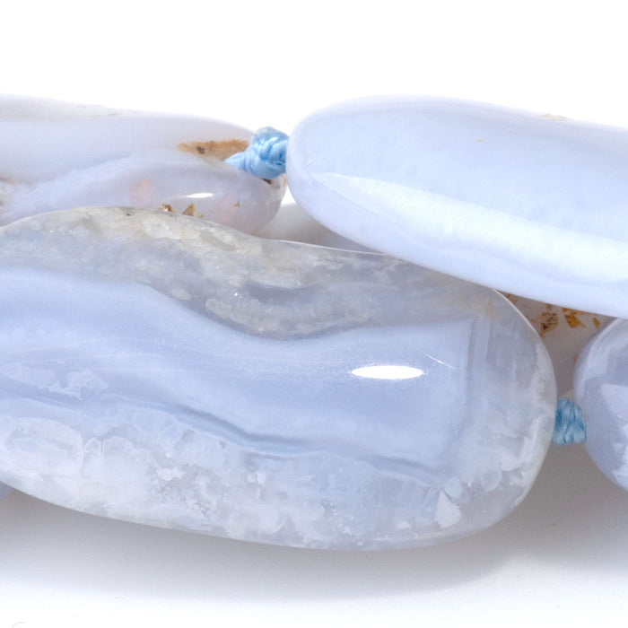 This is a Dakota Stones 15x20-28mm Chalcedony Gemstone strand with free-form oval beads in 15-16 inch strand.