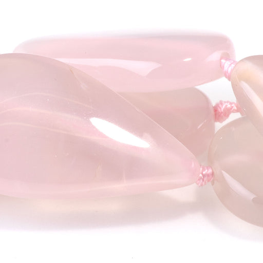 This is a Dakota Stones 15x22-30mm Pink Chalcedony Gemstone strand with tear drop beads in 15-16 inch strand.