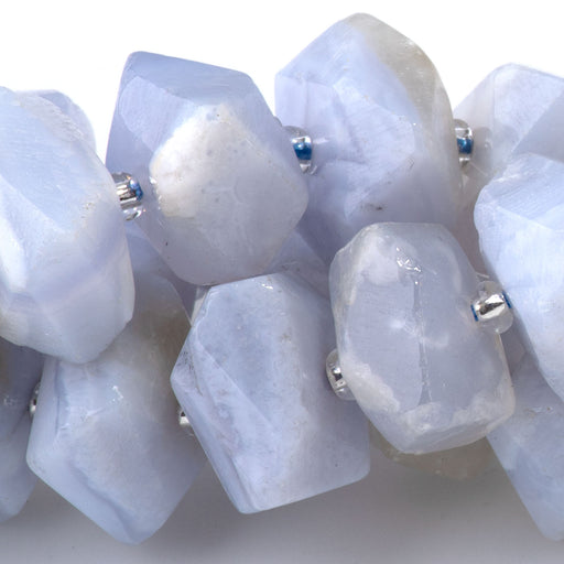This is a Dakota Stones 8x12-10x14mm Blue Chalcedony Drill Gemstone strand with A grade faceted nugget beads in 15-16 inch strand.