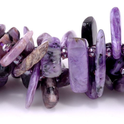 This is a Dakota Stones 5x10-20mm Charoite Top Drill Teeth Gemstone strand of round beads in 15-16 inch strand.
